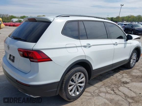 2019 Volkswagen Tiguan S with VIN 3VV0B7AX0KM027036, listed as a IAAI auction lot 42202681 with 75,192 mi miles and . Bid and sale history available at DreamBid. Image 4.