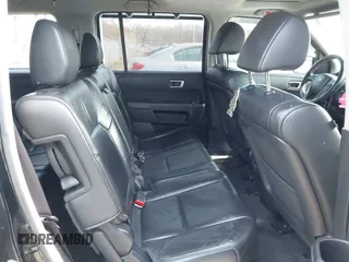 2012 Honda Pilot Touring with VIN 5FNYF4H96CB041380, listed as a IAAI auction lot 41941615 with 137,537 mi miles and . Bid and sale history available at DreamBid. Image 8.