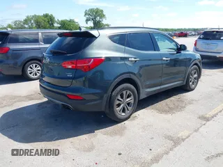 2014 Hyundai Santa Fe with VIN 5XYZUDLB0EG187984, listed as a IAAI auction lot 42607599 with 111,594 mi miles and . Bid and sale history available at DreamBid. Image 4.