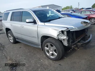 2019 Chevrolet Tahoe LT z VIN 1GNSCBKCXKR219413, wystawiony jako IAAI lot #42013260 z przebiegiem 92 886 mil mil oraz . Historia ofert i sprzedaży dostępna na DreamBid. Obrazek 1.