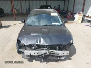 2015 Mitsubishi Lancer Evolution GSR z VIN JA32W8FV2FU020047, wystawiony jako IAAI lot #41890897 z przebiegiem 121 089 mil mil oraz . Historia ofert i sprzedaży dostępna na DreamBid. Obrazek 13.