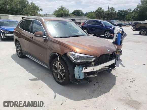 2016 BMW X1 xDrive28i with VIN WBXHT3C31GP880132, listed as a Copart auction lot 69129132 with 74,759 mi miles. Bid and sale history available at carsss.com. Image 1.