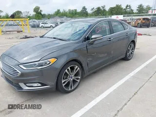 2017 Ford Fusion Titanium with VIN 3FA6P0D93HR261526, listed as a IAAI auction lot 42277350 with 117,388 mi miles and . Bid and sale history available at DreamBid. Image 2.