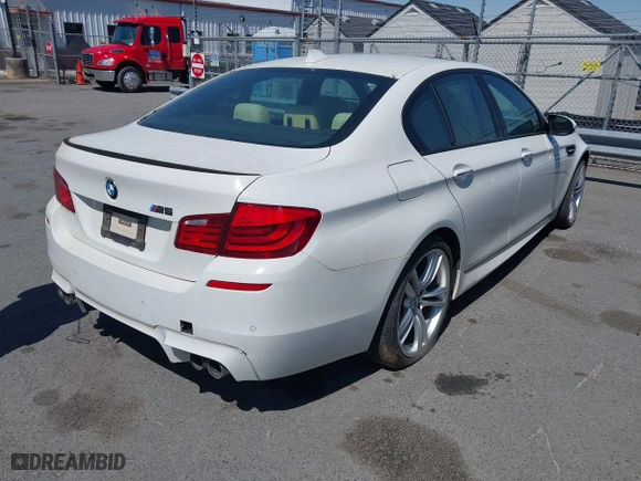 2013 BMW M5 with VIN WBSFV9C58DC773268, listed as a IAAI auction lot 41890830 with 128,399 mi miles. Bid and sale history available at carsss.com. Image 4.