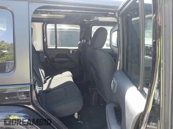 2023 Jeep Wrangler Sahara with VIN 1C4HJXEN5PW702268, listed as a IAAI auction lot 42288704 with 57,240 mi miles and . Bid and sale history available at DreamBid. Image 8.