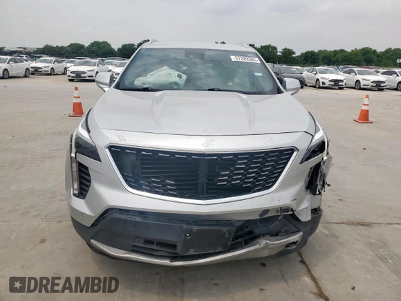 2021 Cadillac XT4 FWD Premium Luxury z VIN 1GYFZCR42MF004233, wystawiony jako Copart lot #57229385 z przebiegiem 98 387 mil mil oraz Szkody całkowita. Historia ofert i sprzedaży dostępna na DreamBid. Obrazek 5.