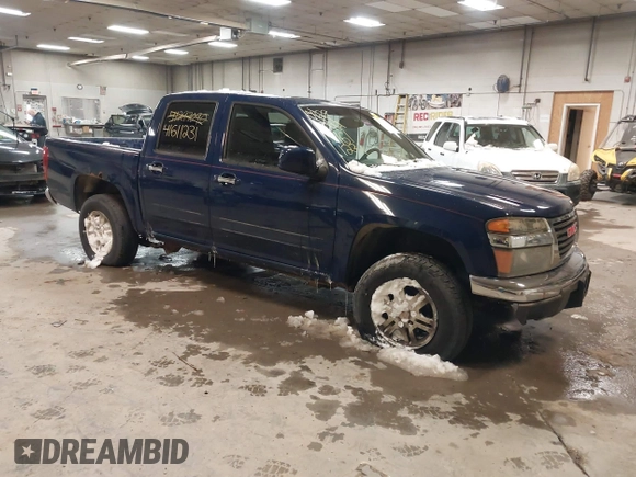 2011 GMC Canyon SLE1 with VIN 1GTH6MFE3B8123808, listed as a IAAI auction lot 41611231 with 142,877 mi miles. Bid and sale history available at carsss.com. Image 1.