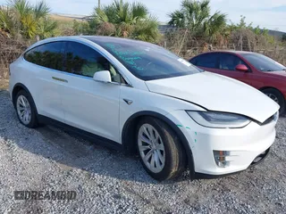 2019 Tesla Model X 75D with VIN 5YJXCAE23KF197563, listed as a IAAI auction lot 41455191 with 163,923 mi miles. Bid and sale history available at carsss.com. Image 1.