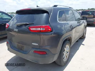 2016 Jeep Cherokee Latitude with VIN 1C4PJLCBXGW265431, listed as a IAAI auction lot 42542328 with 127,249 mi miles and . Bid and sale history available at DreamBid. Image 4.