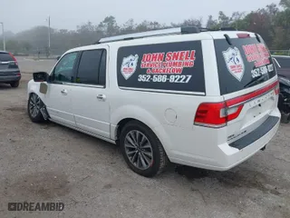 2015 Lincoln Navigator L with VIN 5LMJJ3JT7FEJ05280, listed as a IAAI auction lot 41476190 with 124,580 mi miles. Bid and sale history available at carsss.com. Image 3.