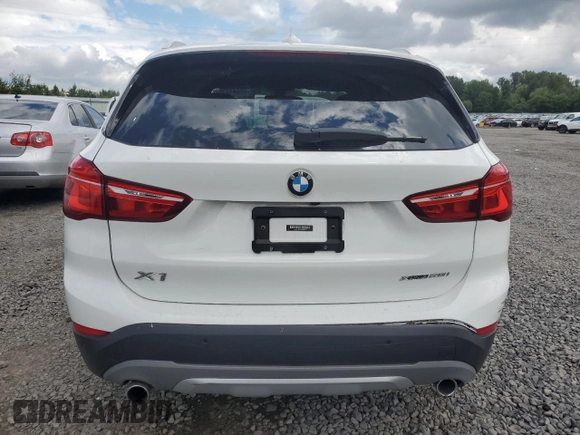 2018 BMW X1 xDrive28i with VIN WBXHT3C35J5L29298, listed as a Copart auction lot 59041435 with 27,612 mi miles and Salvage title. Bid and sale history available at DreamBid. Image 6.