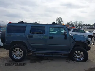 2005 Hummer H2 SUV with VIN 5GRGN23U35H105620, listed as a IAAI auction lot 41912574 with 232,938 mi miles. Bid and sale history available at carsss.com. Image 14.