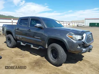 2019 Toyota Tacoma SR z VIN 3TMCZ5ANXKM191842, wystawiony jako IAAI lot #42147540 z przebiegiem 51 909 mil mil oraz . Historia ofert i sprzedaży dostępna na DreamBid. Obrazek 1.
