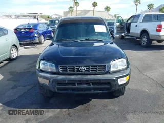1999 Toyota RAV4 with VIN JT3GP10V9X7058125, listed as a IAAI auction lot 42056633 with 247,015 mi miles and . Bid and sale history available at DreamBid. Image 6.