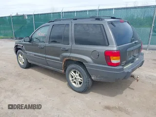 2004 Jeep Grand Cherokee Laredo z VIN 1J4GW48S34C399804, wystawiony jako IAAI lot #42163326 z przebiegiem 203 278 mil mil oraz . Historia ofert i sprzedaży dostępna na DreamBid. Obrazek 3.