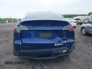 2023 Tesla Model Y Long Range z VIN 7SAYGDEE6PF603981, wystawiony jako IAAI lot #42133348 z przebiegiem 28 566 mil mil oraz . Historia ofert i sprzedaży dostępna na DreamBid. Obrazek 17.