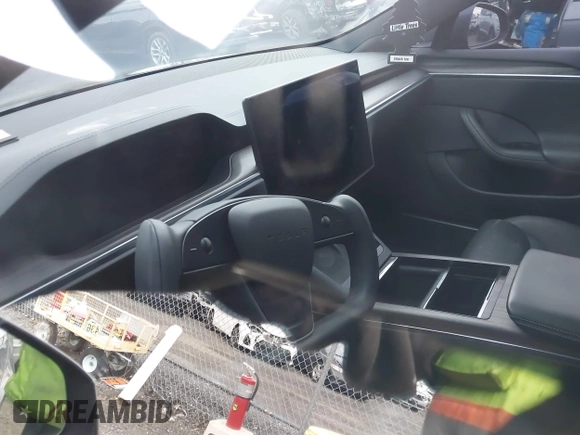 2021 Tesla Model S Long Range with VIN 5YJSA1E51MF440929, listed as a IAAI auction lot 41144902 with Not provided miles and . Bid and sale history available at DreamBid. Image 7.