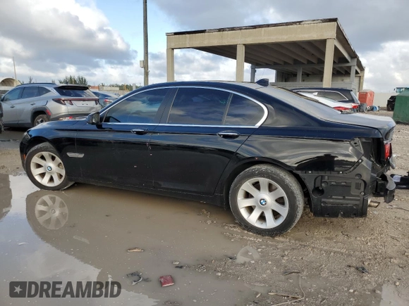 2011 BMW 7 Series 740i with VIN WBAKA4C59BC392351, listed as a Copart auction lot 84942304 with 76,874 mi miles and Salvage Title. Bid and sale history available at carsss.com. Image 2.