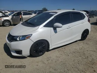 2015 Honda Fit LX with VIN 3HGGK5G59FM738930, listed as a Copart auction lot 65272435 with 89,720 mi miles and Salvage title. Bid and sale history available at DreamBid. Image 1.