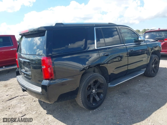 2015 Chevrolet Tahoe LTZ with VIN 1GNSCCKC7FR746028, listed as a IAAI auction lot 41674775 with 198,067 mi miles. Bid and sale history available at carsss.com. Image 4.