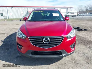 2016 Mazda CX-5 Touring with VIN JM3KE4CY5G0816285, listed as a IAAI auction lot 41888537 with 101,598 mi miles. Bid and sale history available at carsss.com. Image 12.