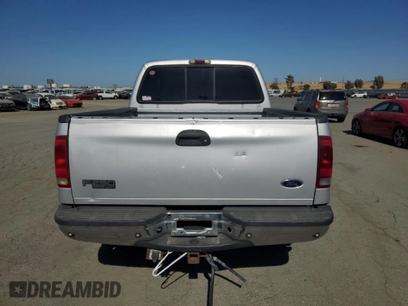 2002 Ford F-250 XL with VIN 1FTNW21L92ED10310, listed as a Copart auction lot 59132935 with 217,885 mi miles and Salvage title. Bid and sale history available at DreamBid. Image 6.