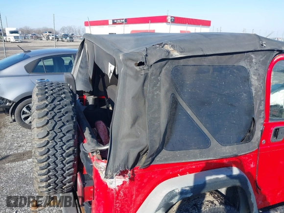 2005 Jeep Wrangler X with VIN 1J4FA39S95P385581, listed as a IAAI auction lot 41333338 with 150,010 mi miles and . Bid and sale history available at DreamBid. Image 13.