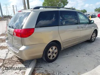 2009 Toyota Sienna CE with VIN 5TDZK23C09S251520, listed as a IAAI auction lot 42155604 with 233,153 mi miles. Bid and sale history available at carsss.com. Image 4.