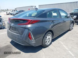 2021 Toyota Prius LE with VIN JTDKAMFPXM3170372, listed as a IAAI auction lot 42661609 with 47,977 mi miles and . Bid and sale history available at DreamBid. Image 4.