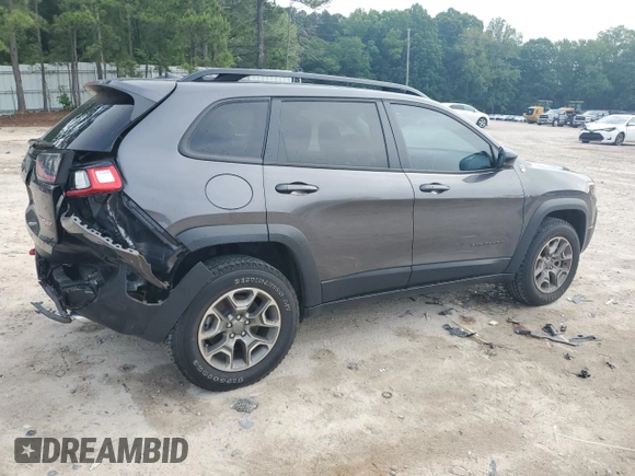 2022 Jeep Cherokee Trailhawk с VIN 1C4PJMBX1ND529146, выставлен на аукционе Copart как лот 56237365 с пробегом 26 718 миль миль и Списание • Salvage title. История ставок и продаж доступна на DreamBid. Изображение 3.