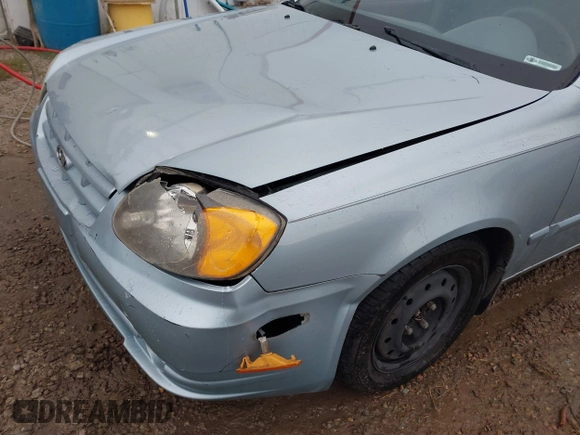 2003 Hyundai Accent GL z VIN KMHCG45C43U465523, wystawiony jako IAAI lot #40883056 z przebiegiem 95 770 mil mil oraz . Historia ofert i sprzedaży dostępna na DreamBid. Obrazek 6.
