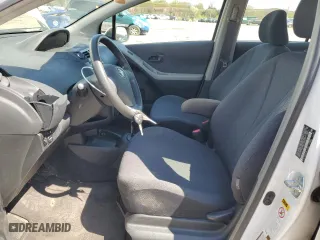 2009 Toyota Yaris with VIN JTDKT903695248767, listed as a Copart auction lot 52327265 with 211,184 mi miles and Salvage Title. Bid and sale history available at carsss.com. Image 7.