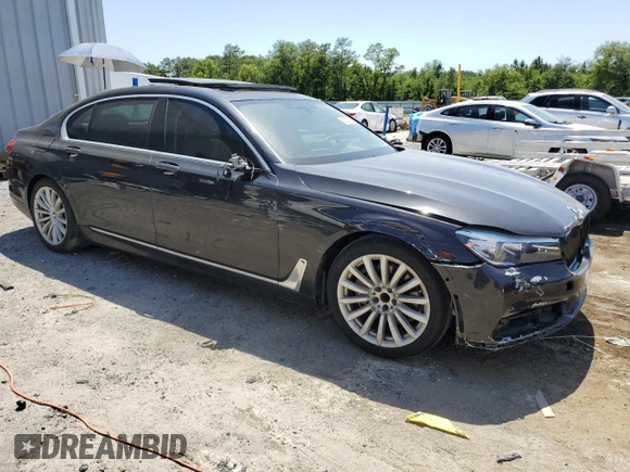 2017 BMW 7 Series 740i z VIN WBA7E2C30HG741105, wystawiony jako Copart lot #56632005 z przebiegiem 95 162 mil mil oraz Czysty tytuł • Clean title. Historia ofert i sprzedaży dostępna na DreamBid. Obrazek 4.