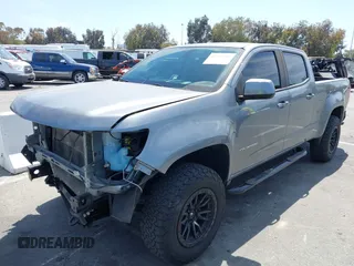 2022 Chevrolet Colorado 4WD Work Truck with VIN 1GCGTBEN2N1148111, listed as a IAAI auction lot 42327481 with 56,506 mi miles and . Bid and sale history available at DreamBid. Image 2.