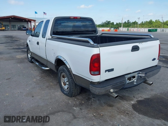 2002 Ford F-150 XL with VIN 1FTRX17242NA69697, listed as a IAAI auction lot 42038258 with 207,008 mi miles. Bid and sale history available at carsss.com. Image 3.