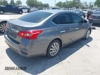 2018 Nissan Sentra S with VIN 3N1AB7AP1JY219661, listed as a IAAI auction lot 42001932 with 114,836 mi miles and . Bid and sale history available at DreamBid. Image 4.