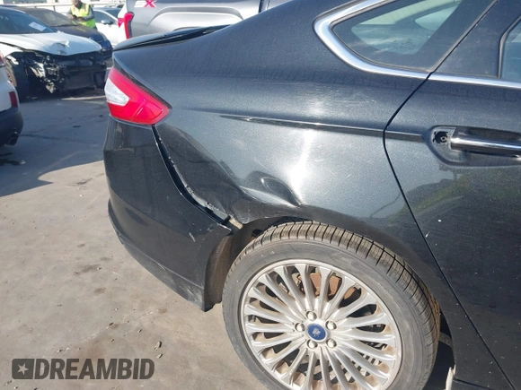 2014 Ford Fusion Titanium with VIN 3FA6P0K94ER115795, listed as a IAAI auction lot 42230295 with 266,277 mi miles and . Bid and sale history available at DreamBid. Image 14.