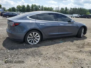 2020 Tesla Model 3 Standard Range Plus with VIN 5YJ3E1EA6LF614045, listed as a Copart auction lot 65222584 with 59,823 mi miles and Salvage Title. Bid and sale history available at DreamBid. Image 3.