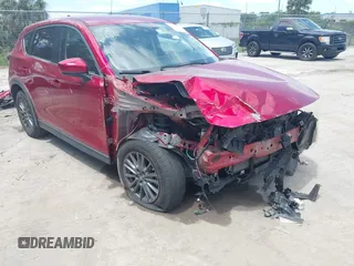 2019 Mazda CX-5 Touring with VIN JM3KFACM6K1549234, listed as a IAAI auction lot 42036633 with 85,065 mi miles and . Bid and sale history available at carsss.com. Image 1.
