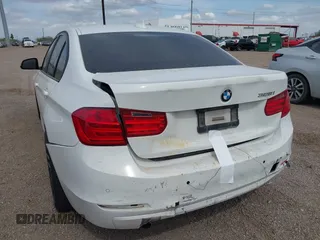 2015 BMW 3 Series 328i with VIN WBA3A5G55FNS85277, listed as a IAAI auction lot 41593498 with 128,265 mi miles and . Bid and sale history available at carsss.com. Image 3.