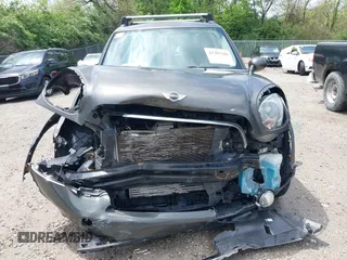 2013 MINI Countryman S ALL4 with VIN WMWZC5C58DWP30600, listed as a IAAI auction lot 42203285 with 76,796 mi miles and . Bid and sale history available at DreamBid. Image 13.