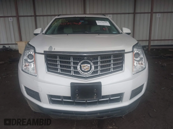 2014 Cadillac SRX z VIN 3GYFNAE32ES580480, wystawiony jako IAAI lot #42170765 z przebiegiem 148 245 mil mil oraz . Historia ofert i sprzedaży dostępna na DreamBid. Obrazek 12.