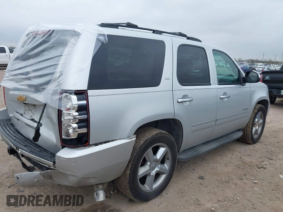 2014 Chevrolet Tahoe LTZ z VIN 1GNSCCE04ER159110, wystawiony jako IAAI lot #41615653 z przebiegiem 171 422 mil mil oraz . Historia ofert i sprzedaży dostępna na DreamBid. Obrazek 4.