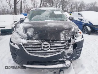 2016 Mazda CX-5 Sport z VIN JM3KE4BY0G0919017, wystawiony jako IAAI lot #41316161 z przebiegiem 209 259 mil mil oraz . Historia ofert i sprzedaży dostępna na DreamBid. Obrazek 12.