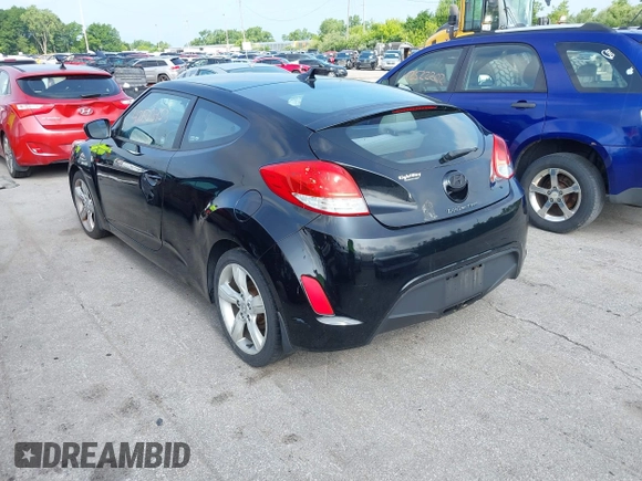2013 Hyundai Veloster w/Gray Int with VIN KMHTC6ADXDU086856, listed as a IAAI auction lot 42503453 with 187,657 mi miles and . Bid and sale history available at DreamBid. Image 3.