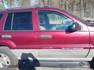 1999 Jeep Grand Cherokee Laredo with VIN 1J4GW58S5XC781472, listed as a IAAI auction lot 41738515 with 216,000 mi miles. Bid and sale history available at carsss.com. Image 13.