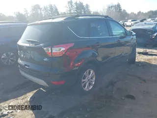 2017 Ford Escape SE with VIN 1FMCU9GD5HUC70341, listed as a IAAI auction lot 41801365 with 135,439 mi miles. Bid and sale history available at carsss.com. Image 4.