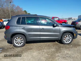 2014 Volkswagen Tiguan SE z VIN WVGAV3AX0EW511694, wystawiony jako IAAI lot #41811345 z przebiegiem 95 129 mil mil oraz . Historia ofert i sprzedaży dostępna na DreamBid. Obrazek 13.