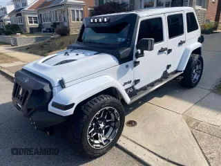 2014 Jeep Wrangler Unlimited Sahara with VIN 1C4BJWEG1EL272951, listed as a Copart auction lot 52157145 with 56,989 mi miles and Clean Title. Bid and sale history available at carsss.com. Image 2.