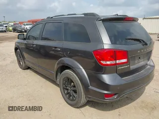 2019 Dodge Journey SE with VIN 3C4PDCBBXKT860142, listed as a IAAI auction lot 42126997 with 101,675 mi miles and . Bid and sale history available at DreamBid. Image 3.
